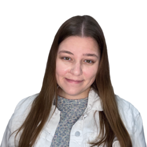 Smiling woman with long hair on a green background.