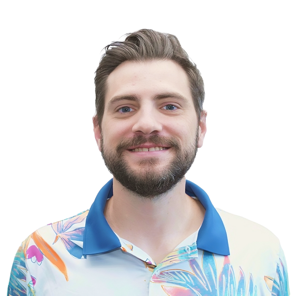 Portrait of a smiling man with beard wearing a light blue shirt,